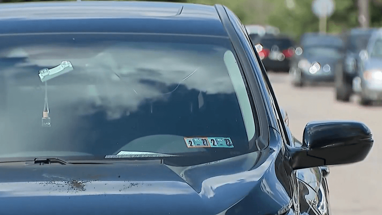 The front of a car driven by a private taxi driver who police said was shot Wednesday in an attempted robbery in East Germantown.