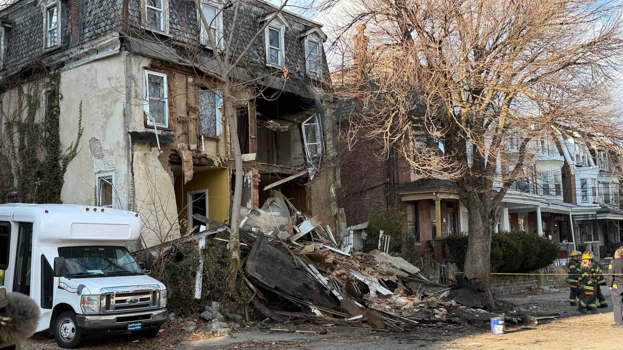The front of a house in Germantown collapsed, injuring two people outside.