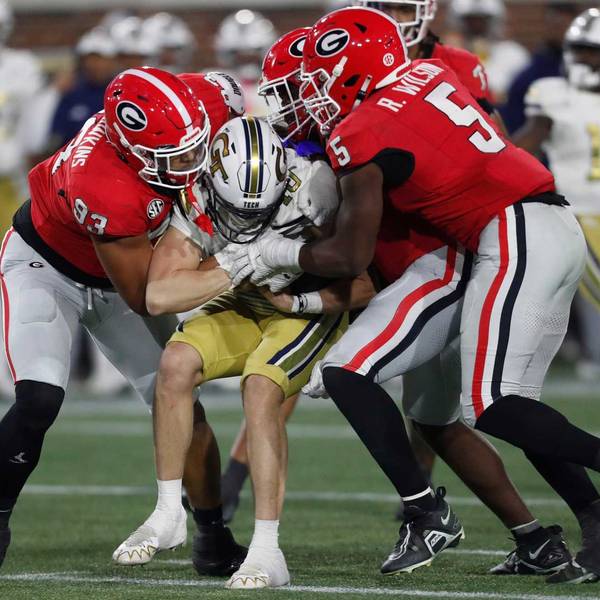 The Georgia defense stops Georgia Tech quarterback Haynes King (10) during the second half of a NCAA college football game against Georgia Tech in Atlanta, on Saturday, Nov. 25, 2023.Georgia won 31-23.