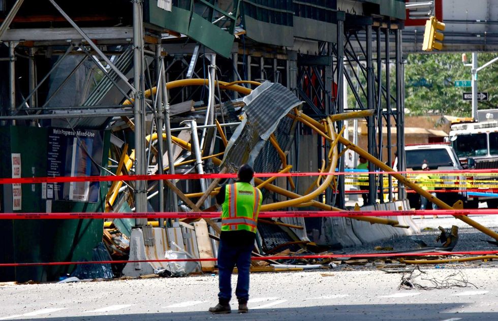 The giant crane arm plummeted to the ground after the fire snapped a cable, FDNY officials said