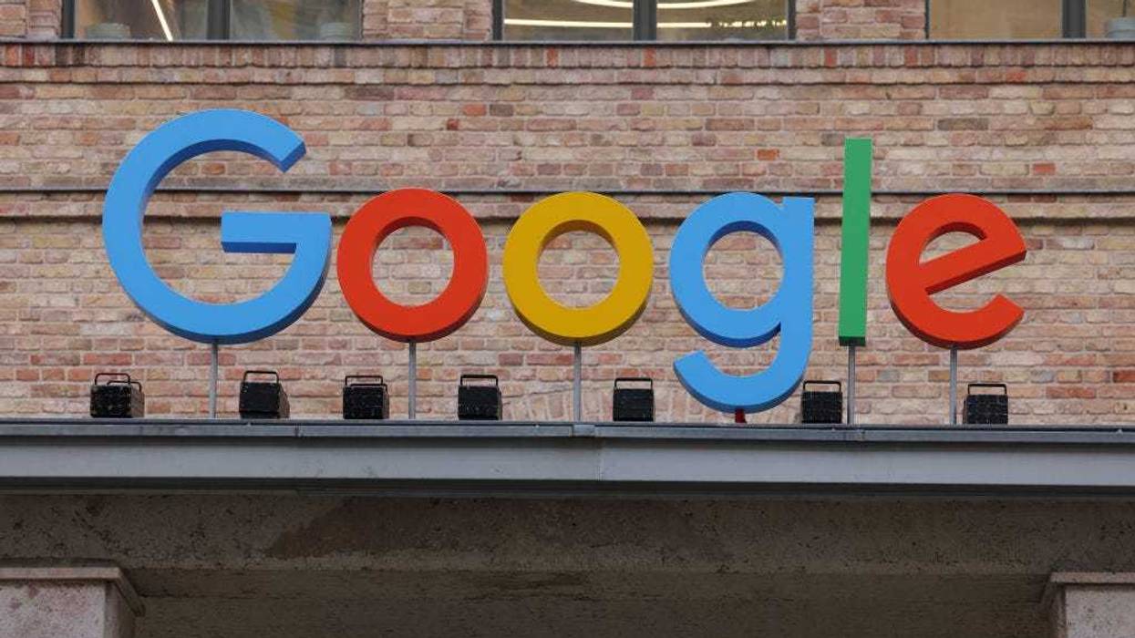 The Google corporate logo hangs outside the Google Germany offices on August 31, 2021 in Berlin, Germany.