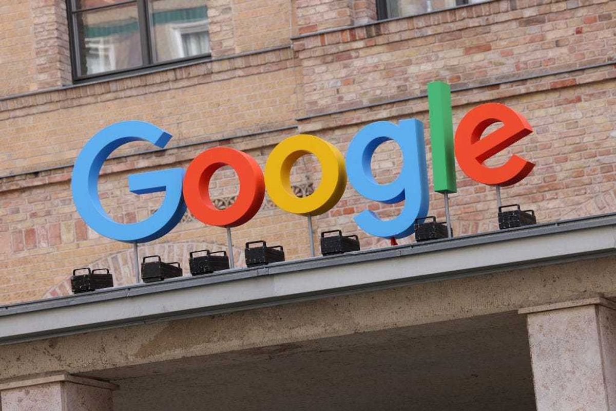 The Google corporate logo hangs outside the Google Germany offices on August 31, 2021 in Berlin, Germany.