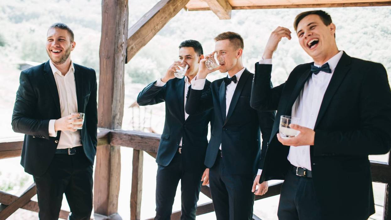 The groom and his friends celebrate the wedding
