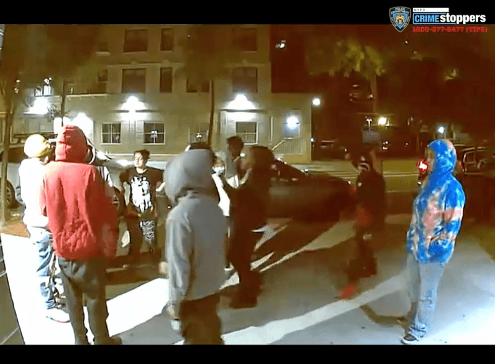 The group fled the scene on foot, and all 12 suspects were still being sought Monday