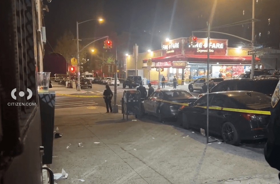 The gunmen fired 10 rounds at the intersection before fleeing on the mopeds, police said
