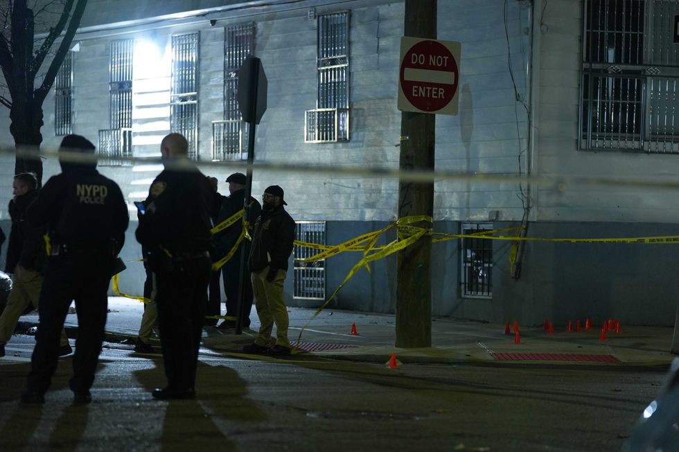 The gunmen fired over 30 times in the direction of a crowd, police said