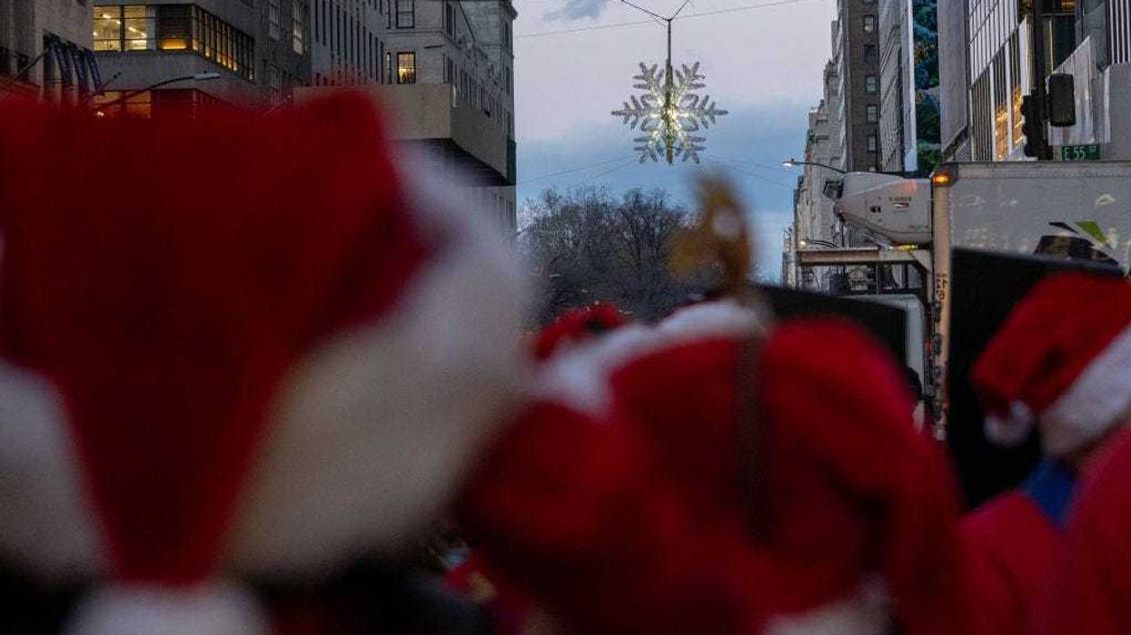 The Holiday Open Streets program stretches to Fifth Ave. and West 57th Street, where a snowflake is suspended 50 feet in the air and lit up.