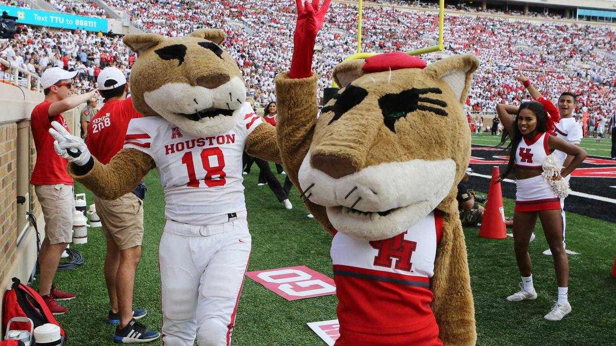 The Houston Cougars mascots entertain the crowd during the game against the Texas Tech Red Raiders at Jones AT&T Stadium.
