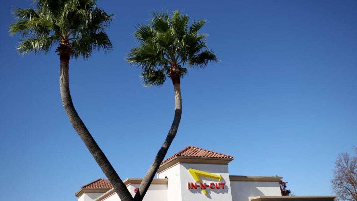 The In-n-Out logo is displayed on the front of an In-n-Out restaurant on October 28, 2021 in Pleasant Hill, California.