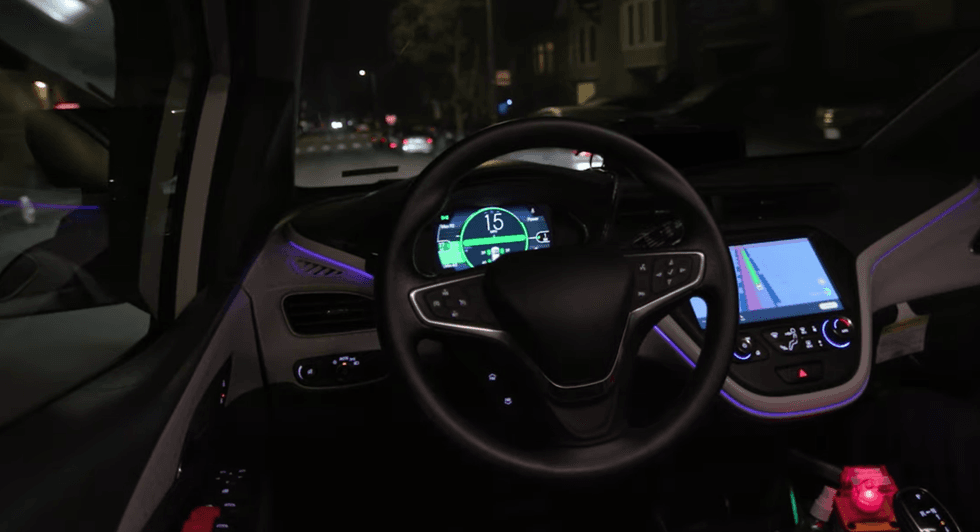 The inside of a fully driverless Cruise vehicle in motion.
