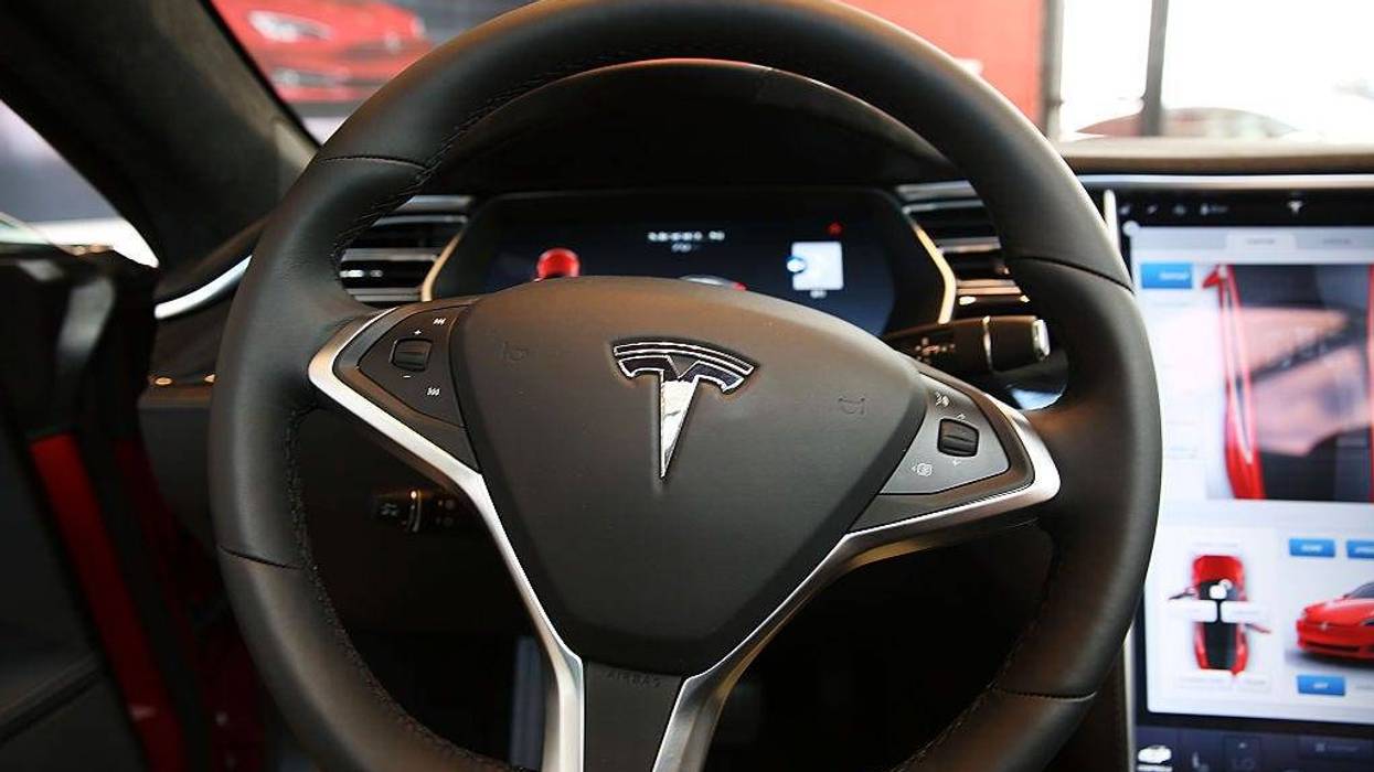 The inside of a Tesla vehicle is viewed as it sits parked in a new Tesla showroom and service center in Red Hook, Brooklyn on July 5, 2016 in New York City.