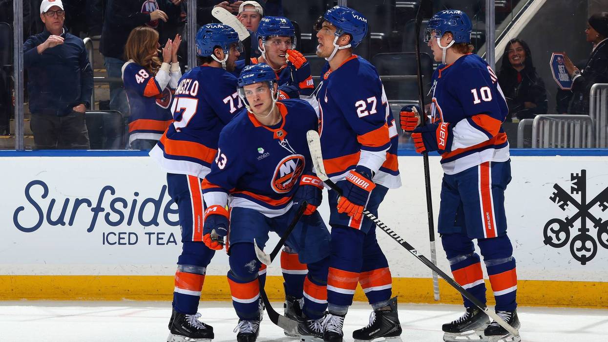 The Islanders celebrate a goal.