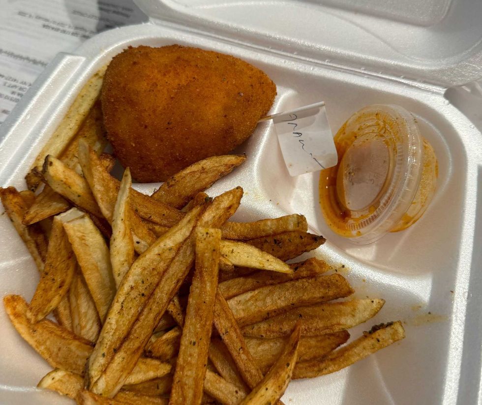 The Italian arancini from Amici-Chicago. Arancini is an Italian dish in which rice balls are stuffed, breaded and deep-fried. At Amici, the dish is served in African, Mexican, Indian, Caribbean and Italian styles.