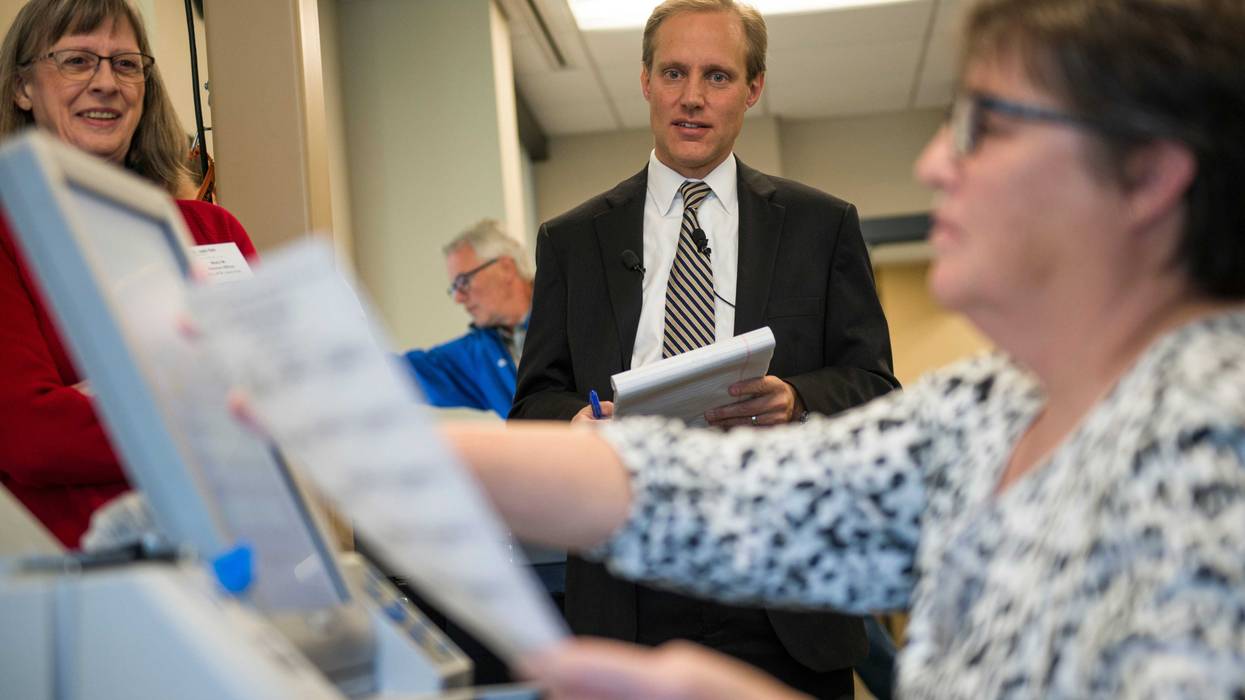 The Justice Department’s Civil Rights Division on Wednesday announced the filing of federal lawsuits against six states for what it said was a refusal to turn over voter registration lists. In Minnesota, Sec. of State Steve Simon (center) says that information is meant to be private.