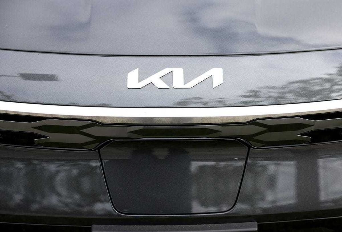 The Kia logo is displayed on a new car on the sales lot at San Leandro Kia on May 30, 2023 in San Leandro, California.