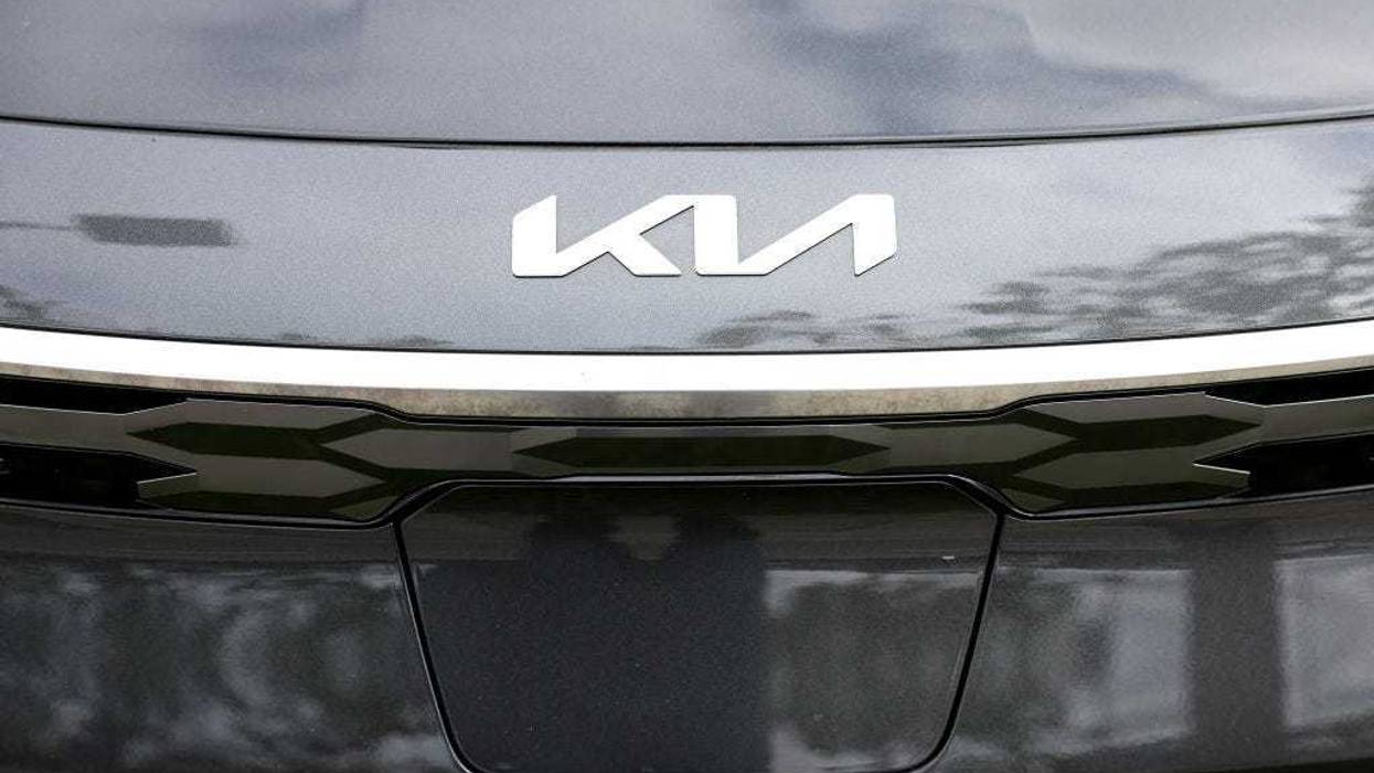 The Kia logo is displayed on a new car on the sales lot at San Leandro Kia on May 30, 2023 in San Leandro, California.