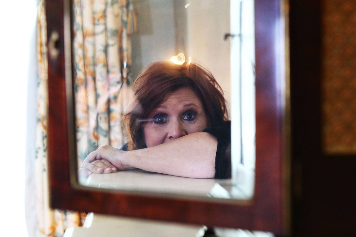 the late carrie fisher poses for a portrait during her "Wishful Drinking" tour at the Sydney Observatory Hotel on October 11, 2010 in Sydney, Australia