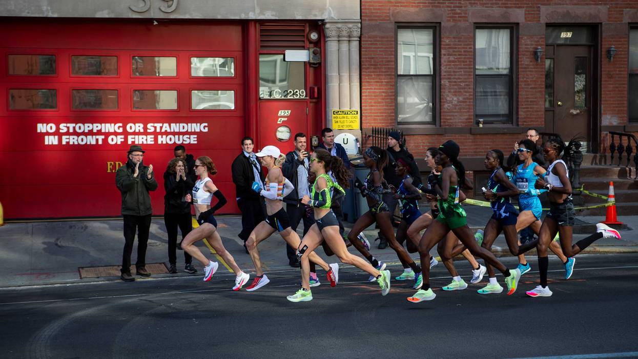 The lead pack of the women's race runs through Brooklyn during the 2021 TCS New York City Marathon in New York City.