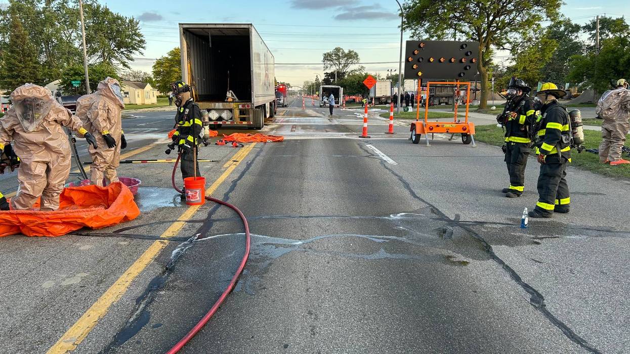 The Livonia Fire Department works to clean up an acid spill on Eight Mile near Middlebelt