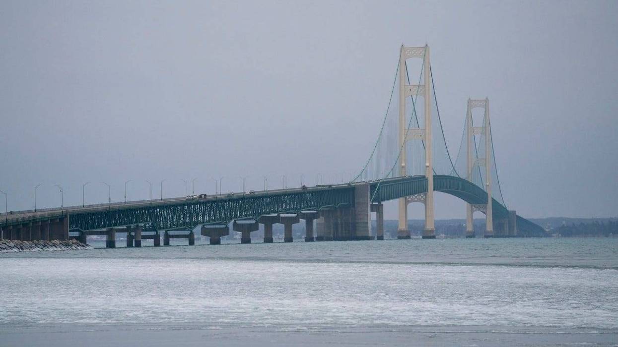 The Mackinac Bridge sits in the background with a barely frozen Lake Michigan on Friday, Jan. 5, 2024.