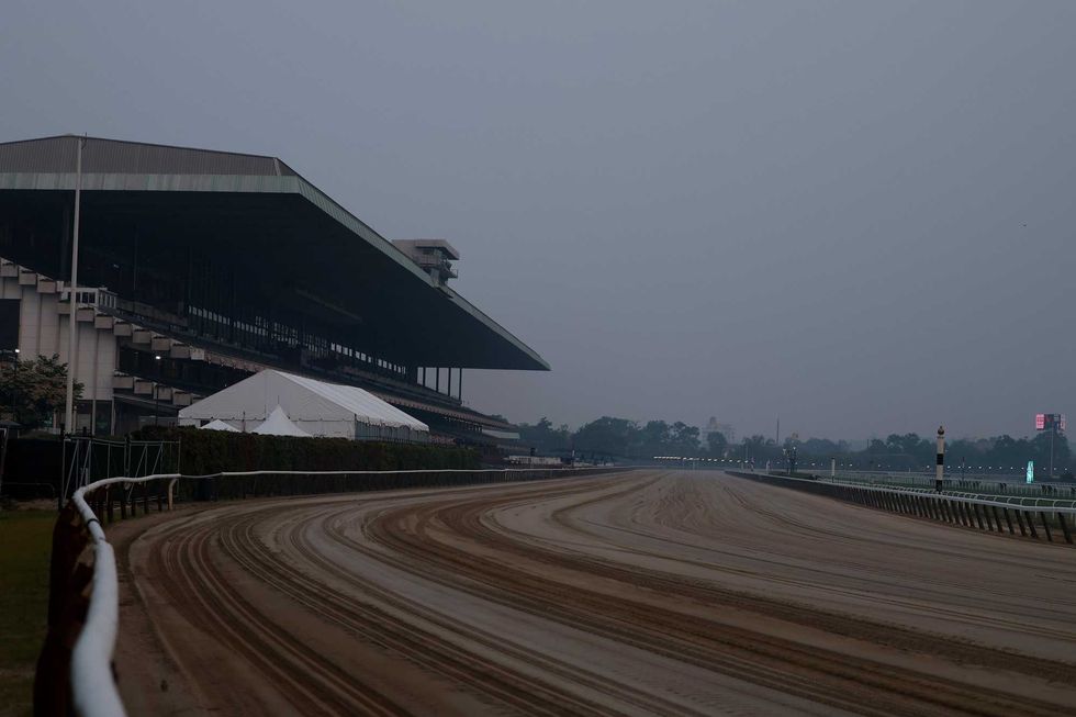 The main track of Belmont Park is seen shrouded in smoke on June 8, 2023, in Elmont, New York