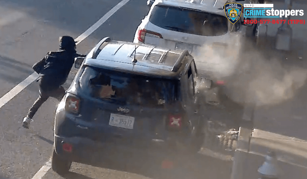 The man ducks for cover and fires shots before fleeing, video shows