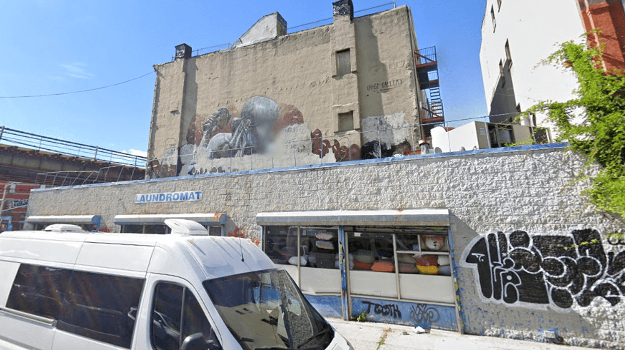 The man was found dead behind 1505 Broadway on Sunday night