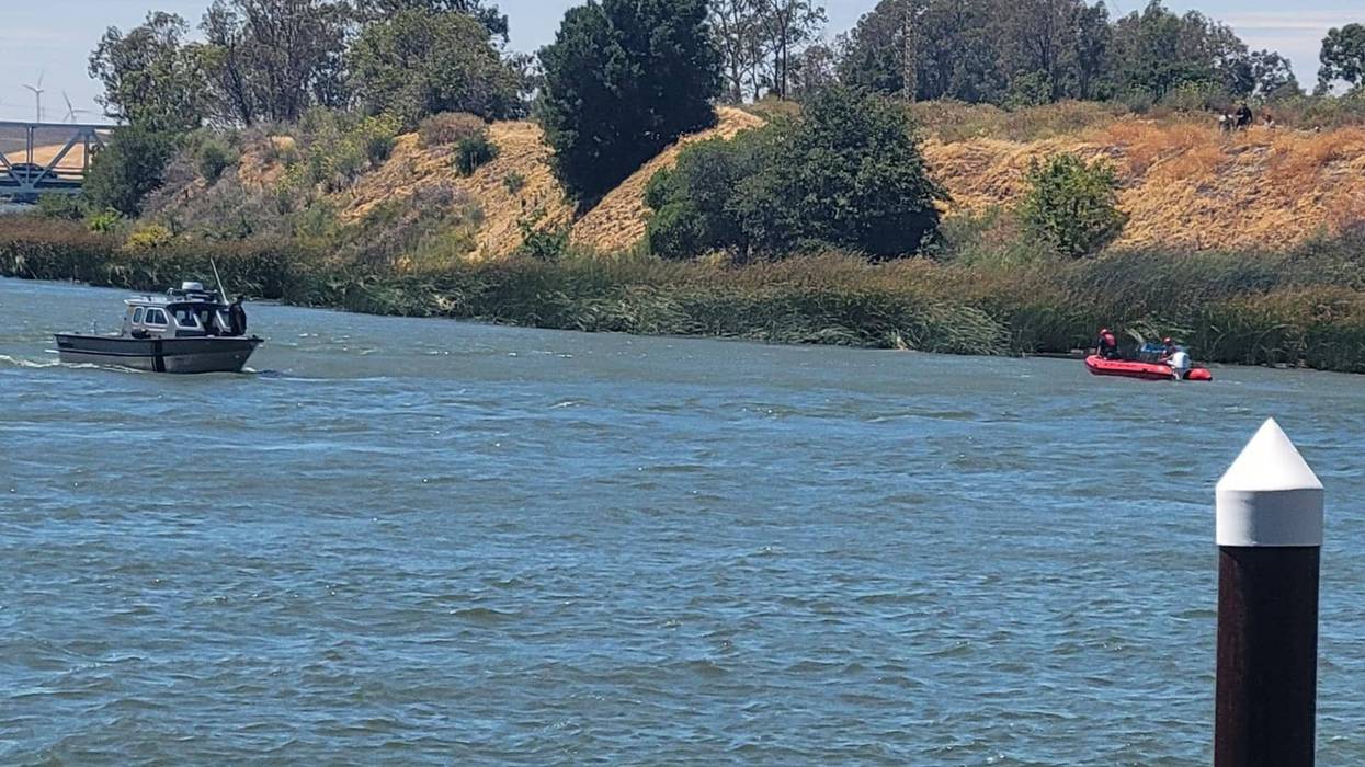 The men jumped into the water at the Three Miles Slough Bridge to rescue an 8-year-old boy.