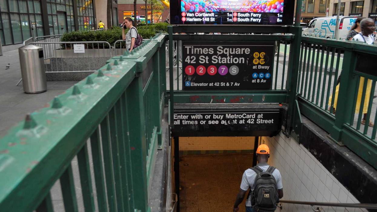 The men were stabbed at the busy Times Square–42nd Street station around 7 a.m. Thursday