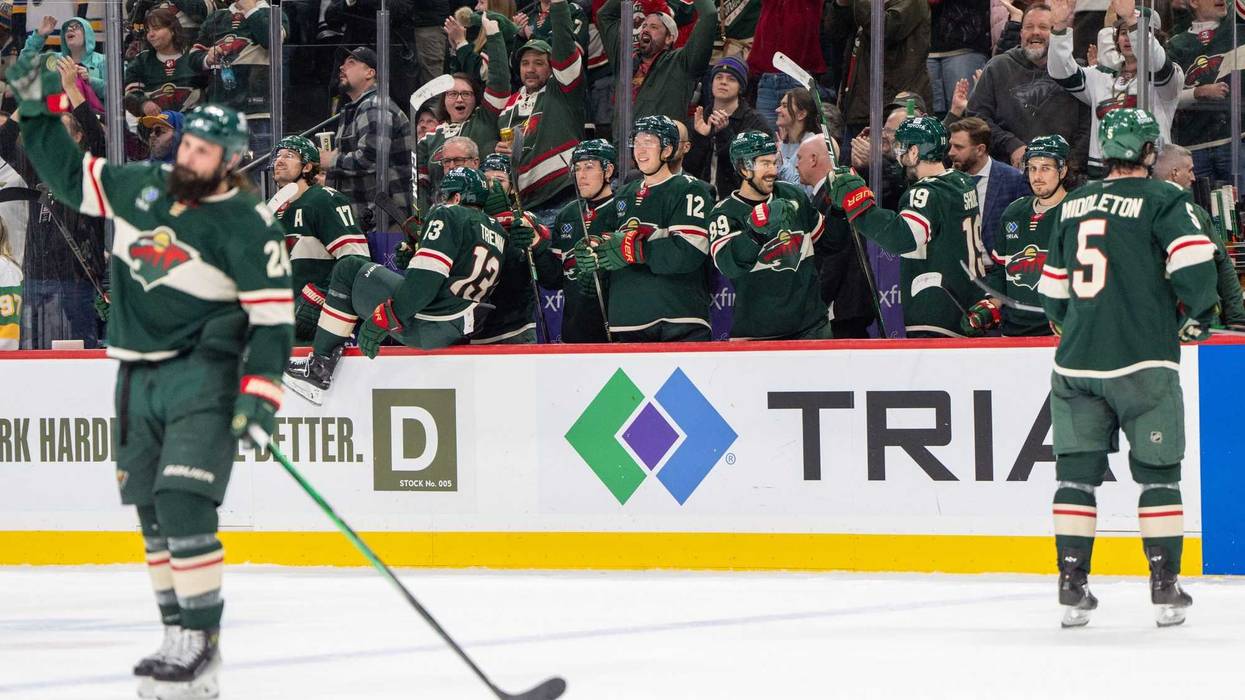 The Minnesota Wild bench celebrate after an empty net goal scored by Minnesota Wild center Marcus Johansson (90) seals the victory against the St. Louis Blues in the third period at Xcel Energy Center.