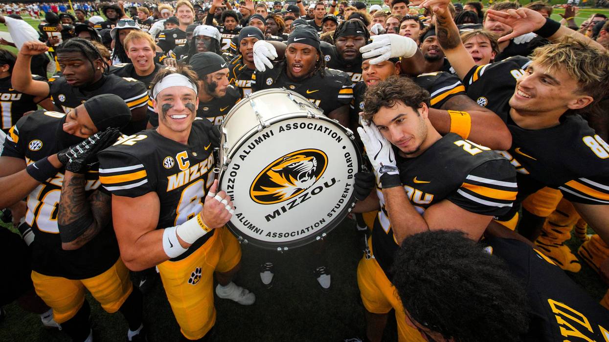 The Missouri Tigers celebrate after defeating the Kansas Jayhawks at Faurot Field at Memorial Stadium.