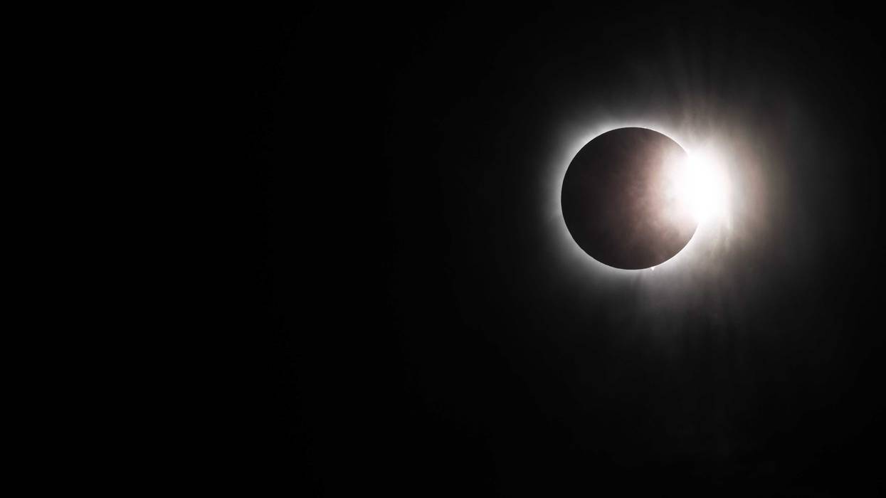 The moon begins its descent below the sun's horizon during a total solar eclipse on April 08, 2024 in Brady, Texas. Millions of people have flocked to areas across North America that are in the "path of totality" in order to experience the eclipse today. During the event, the moon will pass in between the Sun and the Earth, appearing to block the Sun.