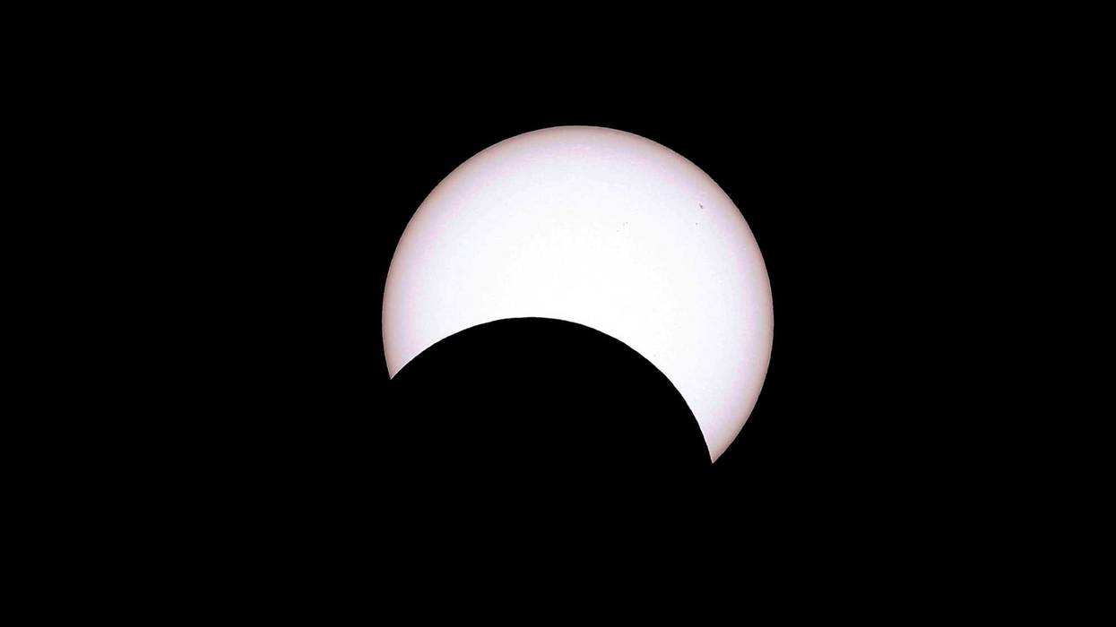 The moon crosses the sun as it exits the maximum eclipse during the Annular Solar Eclipse on October 14, 2023 in Capitol Reef National Park