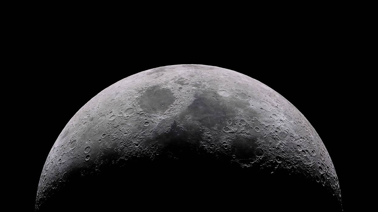 The Moon our satellite companion that illuminates our path during the night on a telescope detailed view with the Lunar craters and seas. An amazing space scene on our lovely Solar System