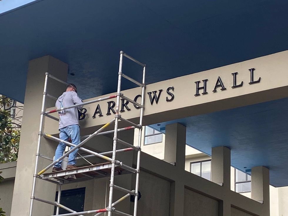 The name of Barrows Hall is removed Wednesday from the UC Berkeley campus.