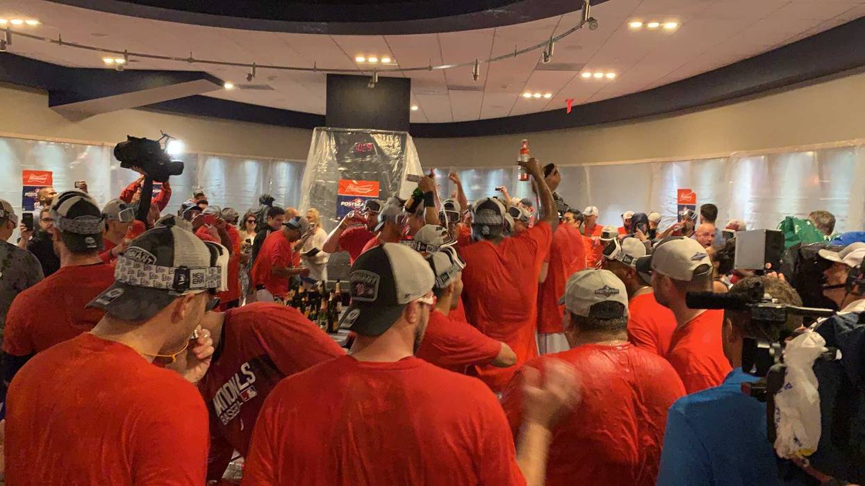 The Nationals celebrate in the clubhouse after clinching a playoff spot.