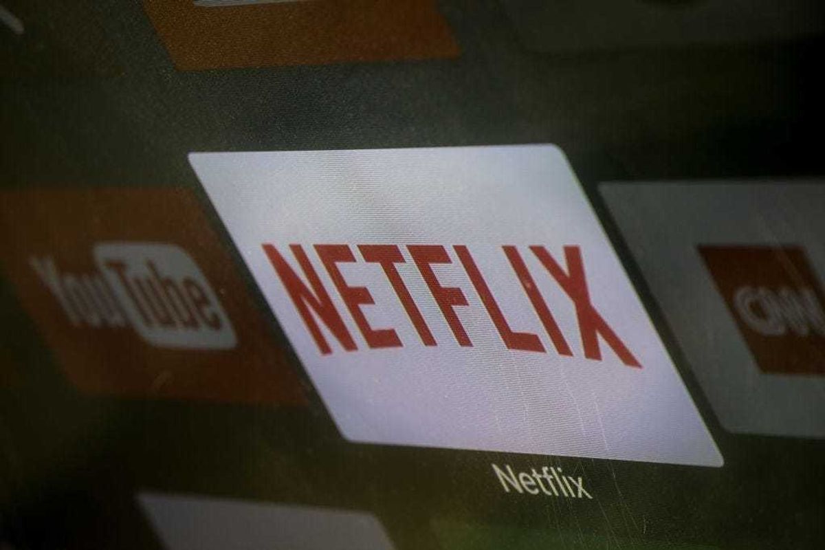 The Netflix App logo is seen on a television screen on March 23, 2018.