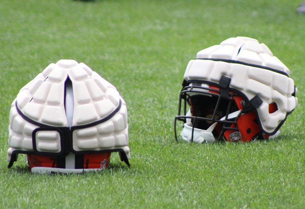 The new Guardian Cap being worn by some position groups during the early weeks of training camp.