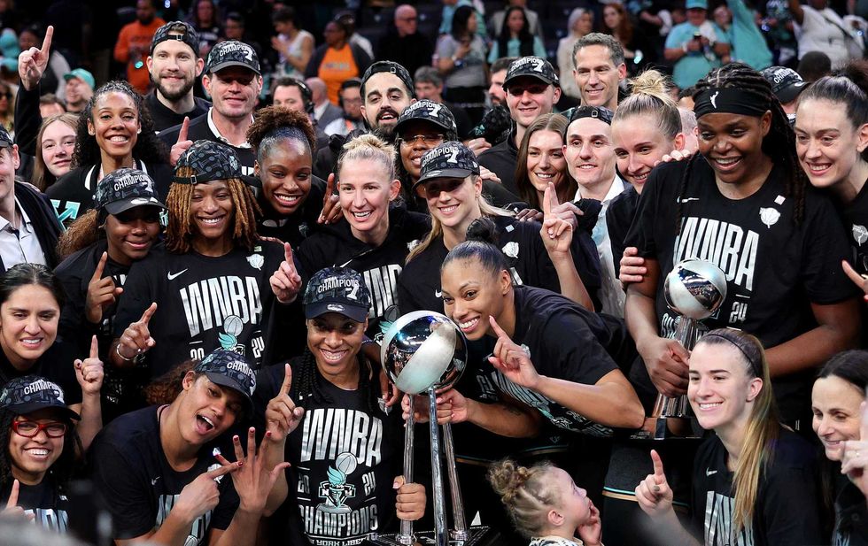 The New York Liberty pose after their win over the Minnesota Lynx in Game 5 of the WNBA Finals at Barclays Center on Oct. 20, 2024