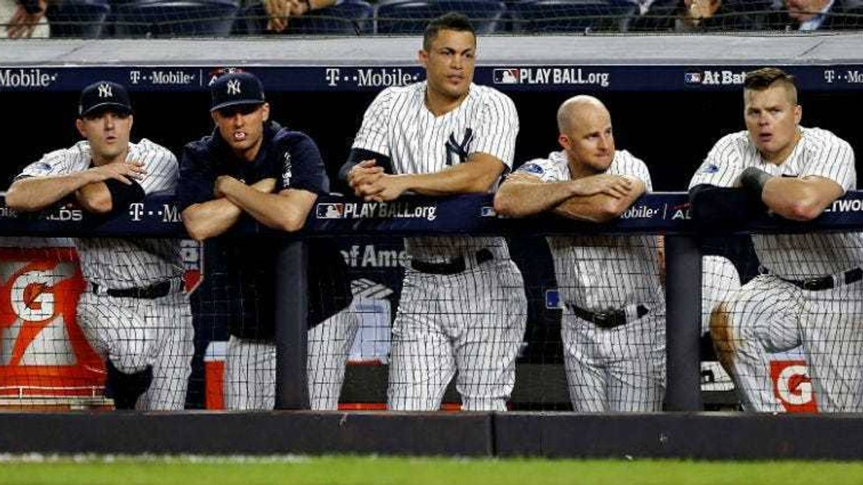 The New York Yankees dugout reacts during the eighth inning against the Boston Red Sox in game four of the 2018 ALDS playoff baseball series at Yankee Stadium.
