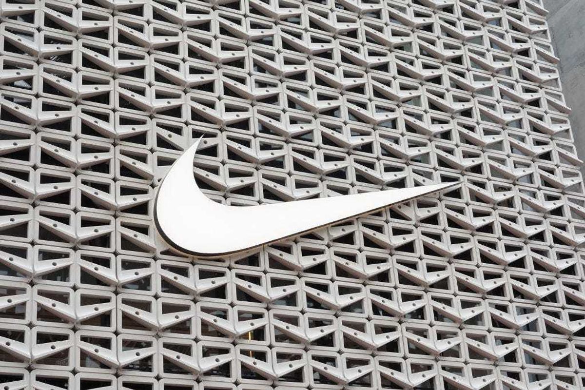 The Nike logo hangs above the entrance to the Nike store on December 21, 2021 in Miami Beach, Florida.