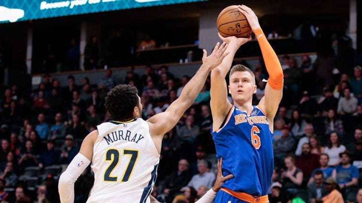 The Nuggets' Jamal Murray (27) defends on a shot from the Knicks' Kristaps Porzingis on Jan. 25, 2018, at the Pepsi Center in Denver.