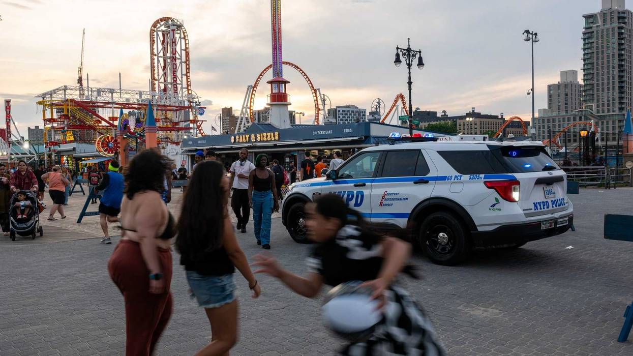 The NYPD patrols Coney Island, near Luna Park, this summer