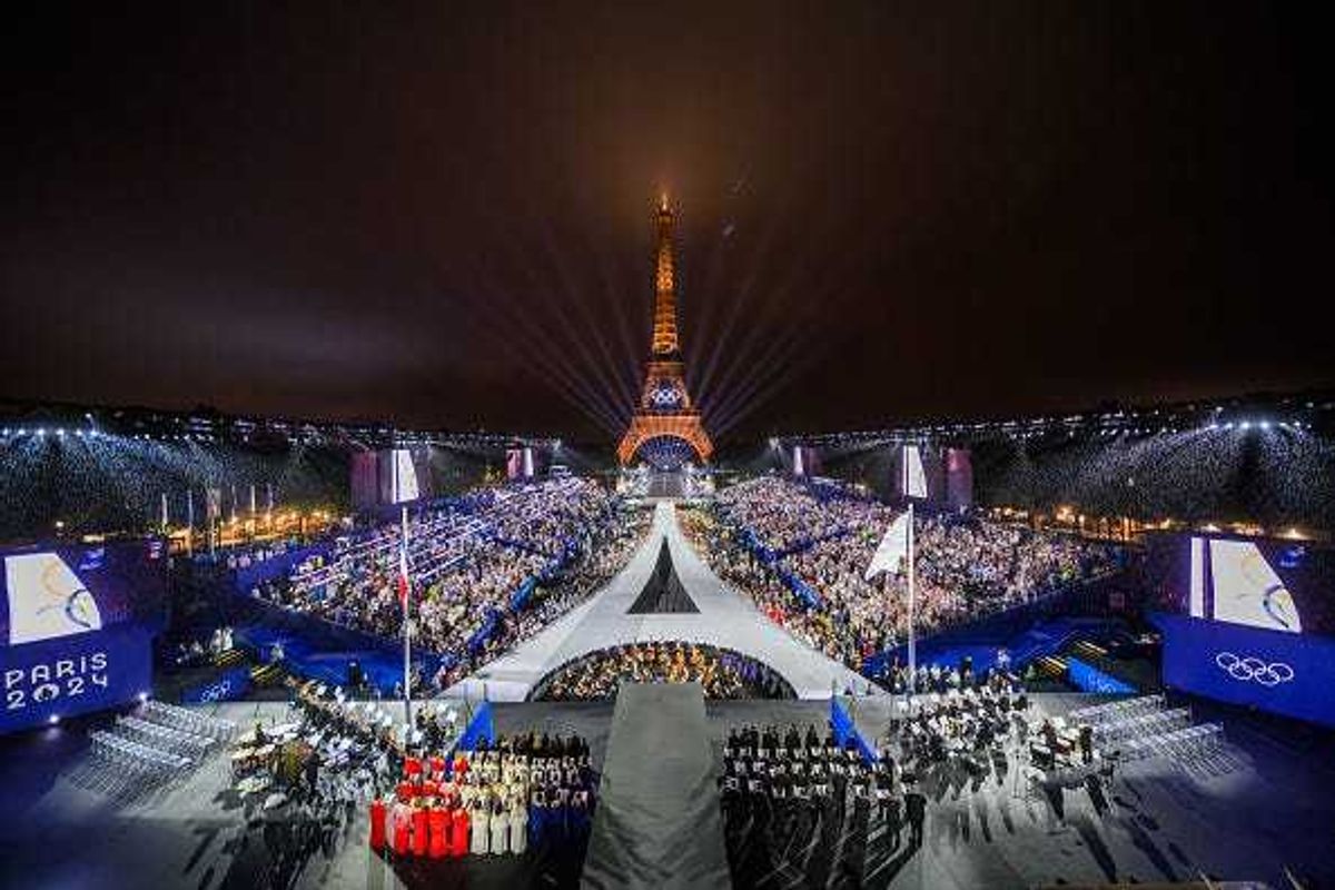 The Olympic flag is rasied at the Place du Trocadero in front of the Eiffel Tower during the Opening Ceremony of the Olympic Games Paris 2024 on July 26, 2024 in Paris, France.
