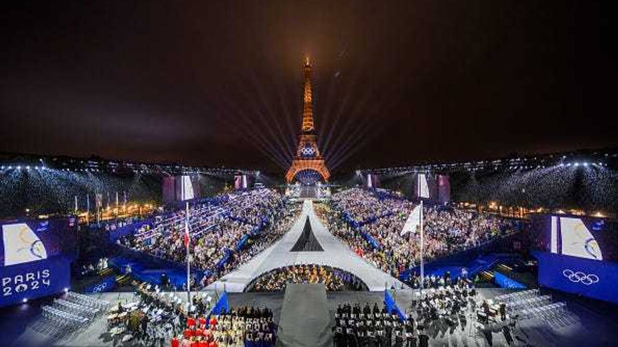 The Olympic flag is rasied at the Place du Trocadero in front of the Eiffel Tower during the Opening Ceremony of the Olympic Games Paris 2024 on July 26, 2024 in Paris, France.