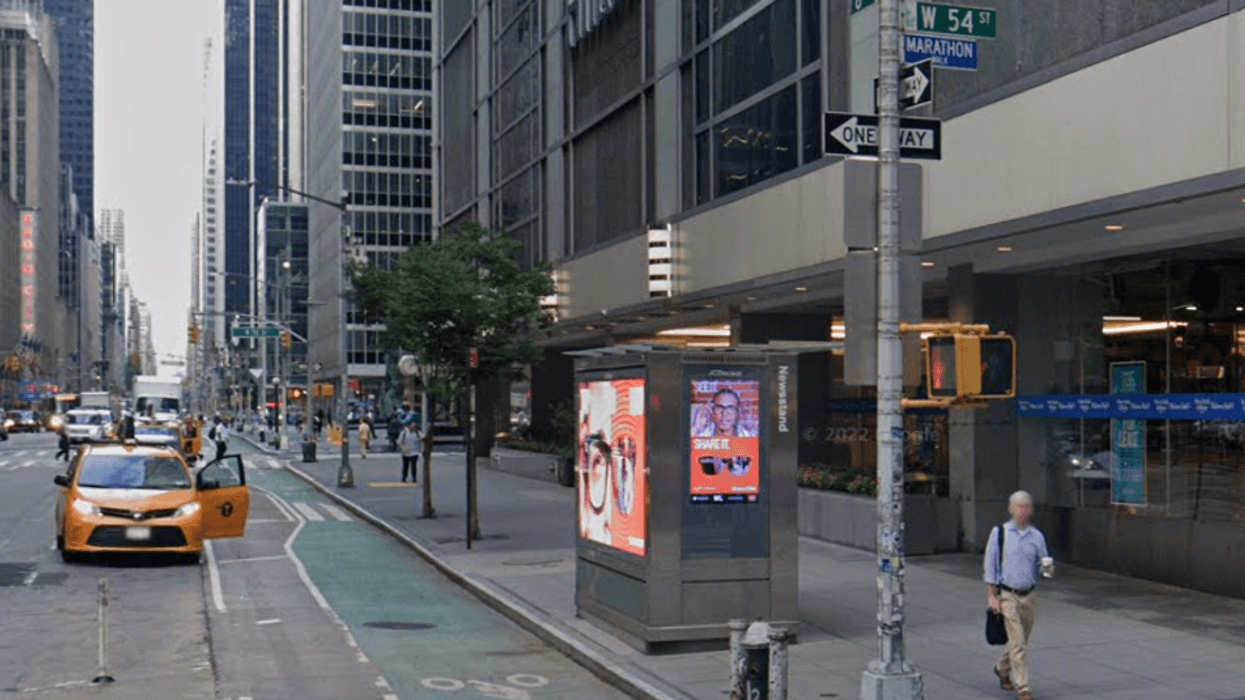 The owner of a newsstand near West 54th Street and Sixth Avenue was robbed early Saturday morning and three suspects are wanted, police said.