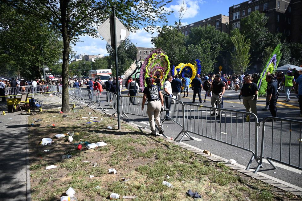 The parade continued past the shooting scene on Monday