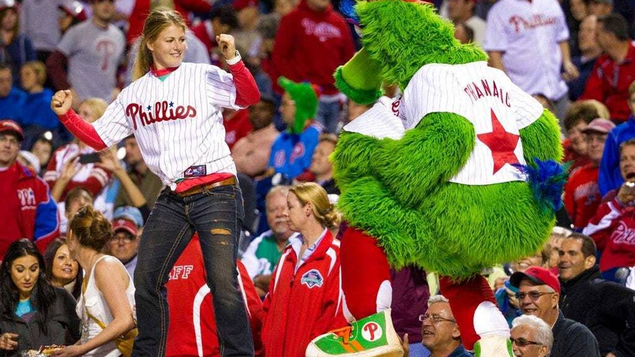 the Phillies Phanatic dancing with a fan