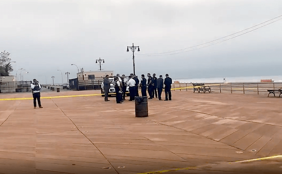 The police investigation continued at the beach into Monday morning