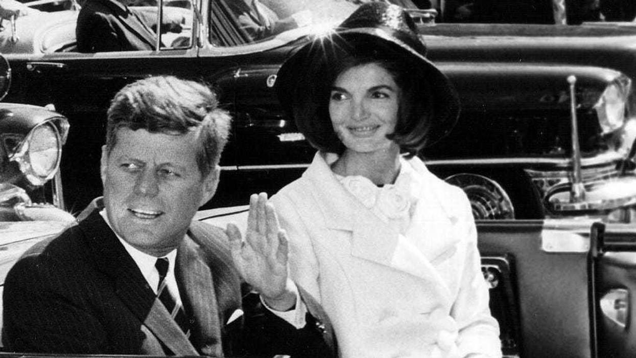 The President and Mrs. Kennedy ride in a parade March 27, 1963 in Washington.